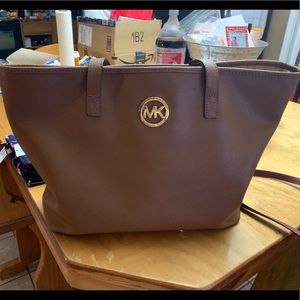 Michael Kors tote with matching wallet.